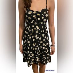 Brand New, Never Been Worn, Floral Dress, Black With Little Yellow And White Flowers. Adjustable Straps. Elastic Back. Removeable Pads In Bust. Slight Ruffles On The End. Medium Casual Fitted Daisy Print Dress, Black Casual Sundress For Spring, Casual Fitted Floral Print Sundress, Casual Black Sundress For Spring, Fitted Black Dress With Daisy Print, Casual Summer Sundress With Daisy Print, Spring Casual Sundress With Daisy Print, Casual Daisy Print Sundress For Summer, Casual Cotton Daisy Print Dress