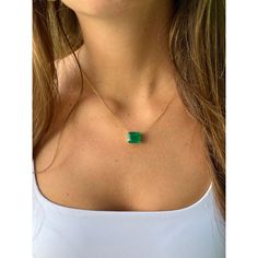 Introducing this Vivid Green Colombian Emerald connecting choker necklace set in 18k solid yellow gold. The pendant seamlessly integrates with the cable chain in what's known as a 'floating' solitaire pendant necklace. The chain necklace features 2 closure holes that allow for an adjustable length on the neck.   This gem displays a very fine, richly saturated vivid green color that is representative of top-quality emeralds. Finely cut to enhance the overall visual appeal and optimize color refraction. Fine quality emeralds in excess of 8 carats are quite rare, and the combination of origin and quality elements for this emerald signifies a gemstone worthy of distinction.   Stationed on an elegant 4-prong basket solitaire mounting. Stamped '750' on the clasp. Video Link: https://youtube.com/ Minimalist Emerald Necklace In Yellow Gold, Modern Green Necklace For Formal Occasions, Modern Yellow Gold Solitaire Necklace Gift, Modern Yellow Gold Solitaire Necklace As Gift, Elegant Emerald Necklace With Cable Chain, Elegant Emerald Necklace With Cable Chain As Gift, Green Cable Chain Necklace For Gift, Modern Single Strand Necklace As Gift, Modern Single Strand Necklace For Gift