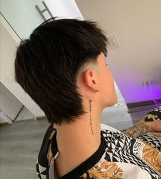 a person with a tattoo on their neck