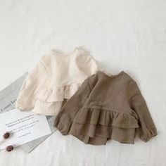 Dress your little one in effortless style with our Campure Toddler Linen Blouse. Crafted from breathable linen, this O-neck blouse is perfect for spring and autumn days. Its classic solid design and comfortable fit make it a versatile wardrobe staple for both boys and girls. Available in a range of sizes, this blouse pairs perfectly with shorts, skirts, or pants. Features: Breathable linen for all-day comfort. Classic O-neck design for a timeless look. Solid colors (including a beautiful rice wh Ruffle Linen, Autumn T Shirts, Lotus Leaf, Korean Casual, Linen Blouse, Loose Blouse, Trendy Tshirts, Linen Clothes