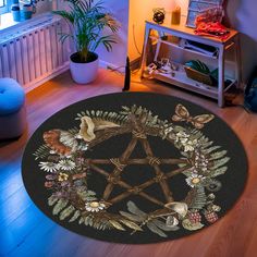 a circular rug with an image of a pentagramil surrounded by flowers and leaves