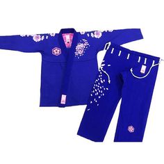 a child's blue kimono and pants with flowers on the side, both in pink