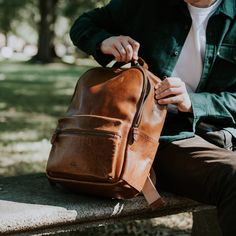 Classic, functional, distinctive. The Walker Leather Backpack checks all the boxes for life’s everyday journeys. Our universal dual-strap pack features premium leather and canvas material, uniting superior quality with timeless style. The primary compartment – accompanied by an easy-access external zipper pocket – offers an efficient storage design complete with laptop sleeve, sewn-in pouch with leather trim, and internal zipper pocket. No matter the place, no matter the plans... the Walker has Classic Cognac Backpack For Travel, Classic Cognac Travel Backpack, Brown Travel Backpack With Smooth Grain, Travel Backpack With Smooth Grain In Brown, Brown Smooth Grain Travel Backpack, Classic Brown Leather Backpack For Daily Use, Classic Backpack With Leather Handles, Classic Leather-backed Satchel Backpack, Cognac Leather Standard Backpack