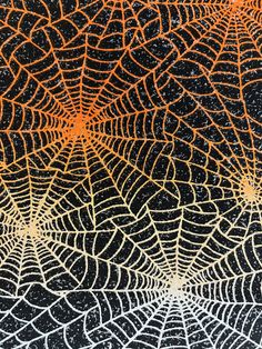 an orange and black spider web pattern