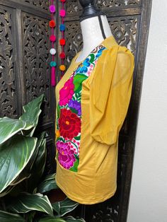 "Trendy Floral Embroidered Blouse - Artisan Made Embroidered Blouse - Chiapas, Mexico Beautiful hand embroidered blouse! This has been made and brought directly from Chiapas, Mexico. The blouse has extremely detailed embroidery. The embroidery is 100% handcrafted. All the work on this blouse has a professional skilled finish and the multicolor embroidered makes it look even more eye catching. The embroidery work is made with great quality thread. The eye catching will be on the embroidered work, Spring Yellow Tops With Resham Embroidery, Traditional Festive Tops With Embroidered Sleeves, Festive Traditional Tops With Embroidered Sleeves, Traditional Tops With Embroidered Sleeves For Festive Season, Yellow Resham Embroidery Top For Spring, Traditional Multicolor Embroidered Top With Embroidered Sleeves, Festive Folk Embroidered Top With Multicolor Embroidery, Traditional Cotton Top With Embroidered Sleeves, Folk Style Floral Embroidered Top For Festive Occasions