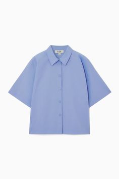 Swap out your long-sleeved shirts for this summery version as the weather warms. It's crafted from pure cotton-poplin that has a naturally breathable quality and designed in a slightly boxy shape that'll work just as well tucked in as it will left loose over skirts and pants.- Regular fit- Button closure- Short sleeves100% Cotton / Machine washBack length of size  6 is 22.04" / Model wears a size 6 Oversized Pea Coat, Cos Shirt, Oversized Linen Shirt, Eyelet Shirt, Modern Tops, Jacquard Shirt, Wool Trench Coat, Cut Sweatshirts, Wool Turtleneck