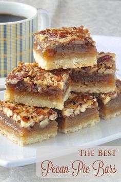 the best pecan pie bars are stacked on top of each other