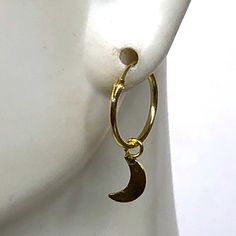 A PAIR of sterling silver hoops dipped in gold. Comes with a tiny crescent moon charm. The charm is multipurpose and can be used with a neck or bracelet chain too. Dimension: Hoop- 12x1 mm Charm- 4 x 9mm Drop length- 18 mm This piece is made of 925 hypoallergenic sterling silver. All my pieces are sent in a gift box. I can include a personal message from you if needed. You are welcome to contact me at... bhavnakwintra1956@gmail.com More hoops: https://www.etsy.com/your/shops/TheSilverGame/tools/ Moon Charm Hoop Earrings In Celestial Style, Celestial Hoop Earrings With Moon Charm, Celestial Round Hoop Earrings With Moon Charm, Gold Celestial Hoop Earrings With Moon Charm, Celestial Gold Hoop Earrings With Moon Charm, Gold Half Moon Hoop Earrings With Moon Charm, Moon Charm Hoop Earrings For Gift, Celestial Small Hoop Nickel-free Jewelry, Celestial Moon Charm Hoop Earrings