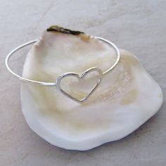 "Sterling Silver Heart Bangle~ Beautiful sterling silver heart bangle, custom made for you! Hammered and polished for that extra sparkle! Looks great worn with one or more! Perfect gift for Valentine's Day, Anniversary or Bridesmaid gift. Made with 14 gauge sterling silver wire Please view the last picture on this listing that shows how to measure for your correct size as there will be a charge for size exchange! For correct size measure the circumference of your hand with a tape measure around Silver Heart Bracelet For Wedding On Valentine's Day, Sterling Silver Bracelet For Wedding On Valentine's Day, Silver Heart Bracelets For Wedding, Sterling Silver Heart Bracelet For Valentine's Wedding, Heart-shaped Sterling Silver Bracelet For Weddings, Sterling Silver Heart Bracelet For Wedding On Valentine's Day, Sterling Silver Heart Bracelet For Wedding And Valentine's Day, Sterling Silver Heart Bangle For Wedding, Wedding Heart Charm Bracelet In Sterling Silver