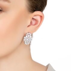 Unveil your inner radiance with the Spencer Statement Drop Earrings in Silver. Crafted with meticulous precision, these earrings are the epitome of elegance and sophistication. Each earring showcases a dazzling oval central stone, encased in a halo of smaller, shimmering stones, creating a breath-taking focal point. Surrounding the central gem is a cluster of delicate, simulated diamond flowers and petals, adding a touch of whimsy and grace to the design.  Whether you're walking down the aisle, The Spencer, Drop Earrings Silver, Pearl Strands Necklace, August Birthstone Jewelry, July Birthstone Jewelry, Statement Drop Earrings, Zodiac Jewelry, Pearl Jewellery Earrings, Jewelry Ring Box