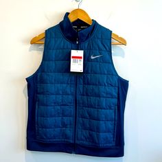 New, With Tags, Nike Women’s Running Vest With Zip Pockets. Multiple Sizes Available. Spandex For Added Comfort And Stretch. Navy Fitted Sports Outerwear, Fitted Navy Sports Outerwear, Blue Sporty Vest For Outdoor, Blue Sporty Outdoor Vest, Blue Stretch Athleisure Outerwear, Blue Stretch Outerwear For Outdoor, Fitted Functional Blue Outerwear, Blue Sporty Outerwear For Work, Functional Blue Vest For Winter