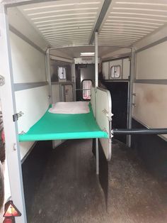 there is a bunk bed in the back of this trailer