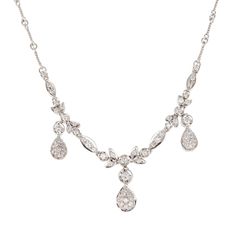 18k white gold and diamond dangle necklace. A coil and link design chain are adorned with a diamond design center. Diamond set petals and marquise shaped links have three separate dangling diamond pave set tear drops hanging with matching sides and a large center 63 round H-I VS-SI diamonds 1.0-2.5mm Approximate .89 carats 18k white gold Tested: 18k Stamped: 750 18k Hallmark: OR 12.3 grams Total Length: 16 inches Width: 2.56mm Thickness/Depth: 2.56 Antique Wedding Bands, Diamond Sapphire Engagement Ring, Antique Engagement Rings Vintage, Dangle Necklace, Antique Jewelry Necklace, Tear Drops, White Gold Necklace, Antique Bracelets, Vintage Sapphire