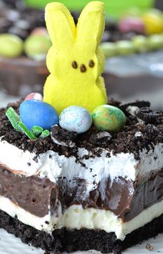 a cake with chocolate frosting and an easter egg on top