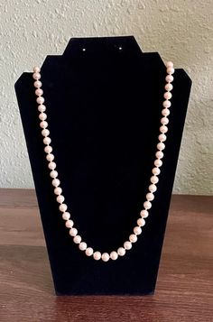 The vintage pearl necklace is absolutely lovely and in great condition. It screams class and elegance and would complement any attire. It has a rich, champagne color, and a silver clasp. Please note that my items are used, vintage, or antique and some will be in an age-related condition including marks, chips, crazing, scratches, dings, dents, etc. I do the best I can to describe them as I see them. Also, the color you see in the picture is as close as I can get to real life. Please remember that monitor and computer settings can make colors look brighter, duller, or completely different. Vintage Pearl Necklaces For Formal Occasions, Single Strand Pearl Necklace For Costume Jewelry, Formal Cream Single Strand Necklace, Formal Cream Beaded Necklaces, Single Strand Pearl Necklace Costume Jewelry, Single Strand Pearl Costume Jewelry Necklace, Formal Cream Beaded Necklace, Classic Pearl Beaded Necklace For Formal Occasions, Elegant Cream Beaded Necklaces For Formal Occasions