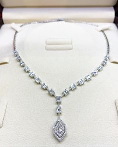 She'll never tire of wearing this unique and sophisticated Illusion diamond necklace. Stunning in 18K solid white gold, this breathtaking line of shimmering round diamonds. So elegant, this 16.0-inch diamond necklace will take her breath away. Radiant with 3.53 cts. t.w. of diamonds and buffed to a brilliant luster, this glamorous keepsake secures with a box clasp. The setting design make the diamonds look much bigger than they are. When worn, the diamonds in the front look like half a carat eme Luxury Emerald Cut Diamond Necklace For Formal Occasions, Luxury Emerald Cut Diamond Necklace For Formal Events, Luxury Platinum Solitaire Necklace For Wedding, Diamond White Baguette Cut Diamond Necklace For Formal Occasions, Formal Platinum Necklace With Emerald Cut, Formal Baguette Cut Diamond White Diamond Necklace, Formal Baguette Cut Diamond White Necklace, Dazzling Platinum Solitaire Necklace For Wedding, Exquisite Emerald Cut Diamond Necklace