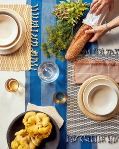 the table is set with plates, bowls and other things to eat for dinner or dessert