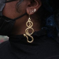 Combining three different mythologies, Egyptian, Norse, Ancient Greek, but named after Eir, the Norse Goddess of healing, it's a large statement snake coiled around itself twice, a symbol of regeneration & growth. In 18k gold plate over bronze with sapphires set into the eyes, handmade in Anna Monet's San Francisco Studios. Spiritual Metal Jewelry In Snake Shape, Spiritual Snake-shaped Metal Jewelry, Symbolic Snake-shaped Brass Jewelry, Spiritual Brass Jewelry In Snake Shape, Spiritual Brass Snake-shaped Jewelry, Adjustable Symbolic Snake-shaped Jewelry, Hand-forged Snake-shaped Jewelry For Gifts, Symbolic Gold Snake Jewelry, Snake-shaped Yellow Gold Earrings For Gift