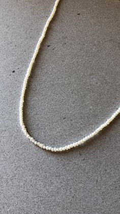 "All of our pearls are sustainably sourced right here in California. This beautiful and delicate freshwater pearl necklace is made entirely out of tiny natural pearls. Each bead is between 2-3mm in diameter. The necklace is 16\" in length." Tiny Pearl Necklace, Freshwater Pearl Necklace, Hand Chain, Freshwater Pearl Necklaces, Chain Ring, Star Necklace, Natural Pearls, Spring Rings, Fresh Water