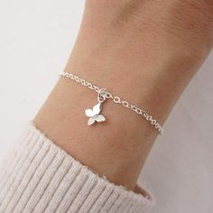 REAL STERLING SILVER - A QUALITY PIECEThis adorable butterfly bracelet is made entirely of 925 sterling silver. The tiny butterfly moves freely along the chain and features a 3D design, measures approximately 14mm by 9mm. Bracelet closes with a lobster claw clasp. Comes in a gift box. SIZING - IMPORTANT: To determine bracelet size, measure snugly around your wrist and add 1/2 inch to get your bracelet size. MATCHING NECKLACE:www.etsy.com/listing/861148339/sterling-silver-tiny-butterfly-necklaceM Kids Jewellery, Stackable Birthstone Rings, Tiny Butterfly, Butterfly Charm Bracelet, Bracelet Dainty, Butterfly Bracelet, Silver Butterfly, Childrens Jewelry, Layered Bracelets