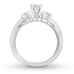 an engagement ring with three stones in the center and two side stones on each side