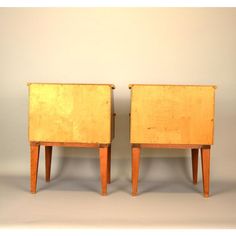 two wooden side tables sitting next to each other