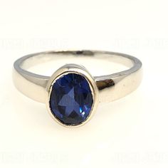 The Ring is made of 925 Silver set with Simulants of Blue Sapphire in Bezel Setting ,Main stones can be replaced on request with a Stone Color of your Choice. This item can be made in Yellow, White or Rose Gold variations of 10K,14K,18K as per your demand. The additional stone options listed are Simulated versions of the said Gemstones and not Natural Gemstones. These are custom made items and are made to order. Request to please clarify all your doubts and queries before placing your order. Pay Oval Birthstone Ring With Polished Finish, Dazzling Oval Sapphire Gemstone Ring, Oval Birthstone Ring With Prong Setting In Sterling Silver, Silver Sapphire Ring With 14k Gold, Dazzling Oval Sapphire Promise Ring, Dazzling Oval Sapphire Ring, Classic Oval Topaz Ring With Bezel Setting, Oval Sapphire Ring With Accent Stones, Fine Jewelry Oval Birthstone Ring In Sterling Silver