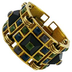 JEAN PAUL GAULTIER vintage rare articulated gold tone geometric cuff bracelet featuring multi colored enameled cabochons. Embossed JPG. Indicative measurements : length approx. 16.5 cm (6.50 inches) / inner circumference approx. 16.2 cm (6.38 inches) / width approx. 3.4 cm (1.34 inches). JEWELRY CONDITION CHART - New or never worn : item is in pristine condition with no noticeable imperfections - Excellent : item has been used and may have not more than two minor imperfections - Good : item has Jean Paul Gaultier Vintage, Buy Earrings Online, Vintage Cuff Bracelet, Buy Earrings, Gold Bracelet For Women, Designer Fashion Jewelry, Colorful Jewelry, Paul Gaultier, Sterling Silver Cuff