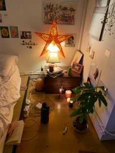 a room with a bed, lamp and pictures on the wall