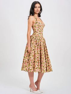 Behold our Niya maxi dress, a stunning union of style and ease. Delicately crafted from a charming floral print fabric, it exudes feminine allure with every step. The drop waist design imparts a contemporary silhouette, while padded cups ensure a flattering fit. Practicality meets elegance with convenient pockets discreetly integrated into the design. Structured with built-in bones and hard mesh supporting the hemline, it promises both form and function. Seamlessly finished with an invisible zipper, this dress is a flawless choice for any special occasion, offering both grace and sophistication. Materials: Linen Length from underarm: Approx 39 inch / 99 cm Stretch Factor: Non Stretch Clean: Dry-clean only Model Is Wearing A Size XS (US-2) Model Is 5'11'' lighting on images. The product ima Floral Print Midi Dress With Fitted Bodice, Sundress With Fitted Bodice For Garden Party, Fitted Bodice Sundress For Garden Party, Midi Length, Fitted Midi Floral Dress For Garden Party, Daywear Dresses With Floral Print And Fitted Bodice, Summer Floral Print Midi Dress With Fitted Bodice, Spring Midi Dress With Fitted Bodice And Floral Print, Brunch Floral Print Dress With Fitted Bodice, Feminine Fitted Bodice Dress For Garden Party