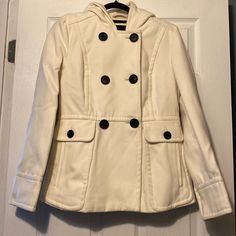 Women’s Winter Jacket. New With Tags. Never Been Worn. Color Is Ivory With Black Buttons. White Winter Blazer With Pockets, White Outerwear With Buttons For Fall, White Buttoned Outerwear For Fall, White Fall Blazer With Pockets, Hooded White Outerwear For Fall, White Hooded Outerwear For Fall, Classic White Outerwear With Buttons, Casual Cream Winter Blazer, Casual Cream Blazer For Winter