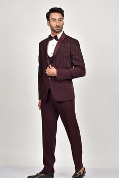 Steel wine tuxedo with bead embroidery details. Paired with a waistcoat, shirt, pant and bow.
Components: 5
Pattern: Embroidered
Type Of Work: Bead
Neckline: Lapel collar
Sleeve Type: Long
Fabric: Crepe, Handloom Silk, Terry Rayon
Color: Wine
Other Details: 
Note: Brooch and pocket square shown in the image is not for sale.
Occasion: Reception, Cocktail - Aza Fashions Embellished Fitted Sets For Gala, Fitted Tuxedo Style Blazer For Gala, Fitted Tuxedo Blazer For Gala, Fitted Notch Lapel Blazer For Gala, Tailored Tuxedo Sets For Gala, Tailored Embellished Suits For Gala, Luxury Fitted Suits For Gala, Elegant Fitted Outerwear For Gala, Luxury Embellished Fitted Sets