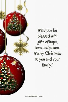 two christmas ornaments hanging from strings with the words, may you be blessed with gifts of hope, love and peace merry christmas to you and your family