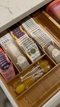 an open drawer in a kitchen filled with condiments