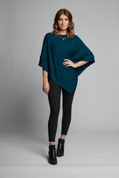 A longer version of our signature poncho sweater in a modal or rayon blend fabric—an ultra soft and lightweight jersey that feels like cashmere on the skin. Designed to look fashionable and provide warmth while remaining breathable and comfortable. This . is flexible layering piece that will keep you warm during the winter months. Layer with a t-shirt, jeans, leggings, dresses or skirts. Keep one in your bag for when need it at work, for night out, or on the road. One Size Fits All Available Col One Size Cashmere Poncho For Layering, Casual Cashmere Poncho For Fall, Oversized Solid Poncho For Layering, Oversized Poncho For Layering, Batwing Sleeve Poncho For Layering, Cozy Batwing Sleeve Tops For Layering, Versatile Batwing Sleeve Tops For Layering, Layering Poncho In Soft Knit, Soft Knit Poncho For Layering