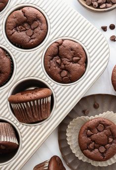 chocolate muffins in a cupcake pan with other muffins