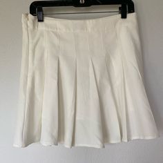 In Perfect Condition, Never Worn Classic Solid Tennis Skirt For Spring, Classic Flared Tennis Skirt For Spring, Classic Tennis Skirt For Spring, Classic Spring Tennis Skirt, Classic Mini Tennis Skirt For Spring, Spring Flowy Tennis Skirt, Classic Lined Skort For Spring, Classic Spring Flared Skort, Spring Classic Lined Skort