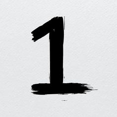 the number one is painted in black on a white paper background, and it appears to be an ink blotch