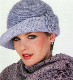 an open book with a woman wearing a hat and scarf on top of her head