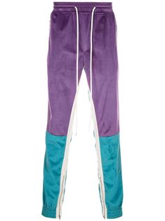 Purple and blue velvet tapered trousers from God's Masterful Children featuring an elasticated waistband with a drawstring fastening, a panelled colour block design and a fitted silhouette. Retro Trousers, Tapered Trousers, Tapered Pants, Block Design, Designer Clothes For Men, Fitted Silhouette, Colour Block, Retro Look, Curator Style