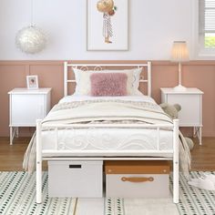 a white bed sitting in a bedroom on top of a hard wood floor next to a dresser