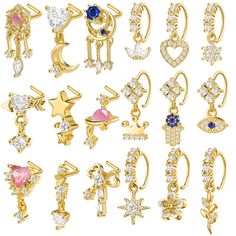 many different types of earrings are shown in this image, including one with an arrow and two