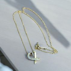 PLEASE MAKE SURE YOU WANT THIS ITEM.  PRICE IS AT BARE MINIMUM SO NO RETURNS. Great Discount Watches & Jewelry Tiffany & Co.  Paloma Picasso Love Heart Diamond Necklace 18K Gold Length 16.50" Details: Tiffany & Co 18K Yellow Gold, 750 Diamond Heart Necklace 11 Round Brilliant Diamonds  Paloma Picasso Length 16.50" Weight 2.9 grams Clasp-Spring Ring Signed -------------------------------------------------------------------------------------------------------- Authenticity Guarantee:You can have confidence that this item will undergo a professional inspection to verify that it is authentic and matches the listing details through eBay Authenticity Guarantee program. --------------------------------------------------------------------------------------------------------- Condition: Pre-owned i Tiffany Necklace Yellow Diamond, Heart Diamond Necklace, Jewelry Tiffany, Diamond Heart Necklace, Bare Minimum, Loving Heart, Paloma Picasso, Heart Necklace Diamond, Heart Diamond