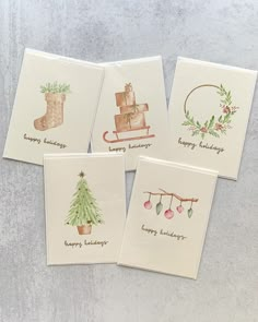 four greeting cards with christmas designs on them