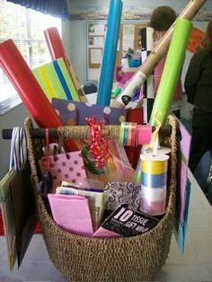 a basket filled with lots of different types of crafting supplies on top of a table