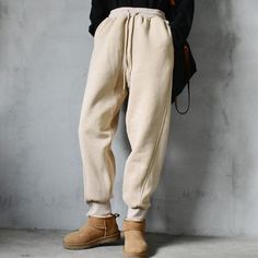 Beige Winter Streetwear Pants, Winter Beige Streetwear Pants, Winter Streetwear Beige Pants, Beige Baggy Bottoms For Winter, Beige Baggy Winter Bottoms, Casual Beige Pants For Winter, Baggy Joggers With Elastic Waistband For Fall, Fall Leisure Pants With Drawstring, Beige Leisure Pants For Fall