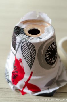 a roll of toilet paper sitting on top of a wooden table