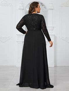 a woman in a long black dress with sheer sleeves and lace on the top, looking back