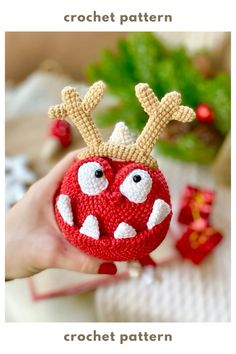 a crochet christmas ornament with reindeer antlers on it