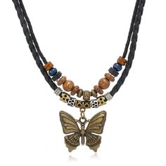 PRICES MAY VARY. Elegant and Fashionable Design: The necklace has a layered design, adding a wooden bead necklace on top of the butterfly charm, which makes the necklace more fashionable at the same time of elegance, and it can bring you a kind of elegant and unique fashionable atmosphere in any occasions. Quality Material: The hippie necklace is made of high quality alloy and high quality leather, sturdy and durable, nickel and lead free. The outer layer of the necklace is made of waxed rope, w Hippie Choker Necklace, Boho Pendant Necklace, Wooden Bead Necklaces, Braided Necklace, Versatile Jewelry, Hippie Necklace, Boho Pendant, Layered Design, Neck Chain